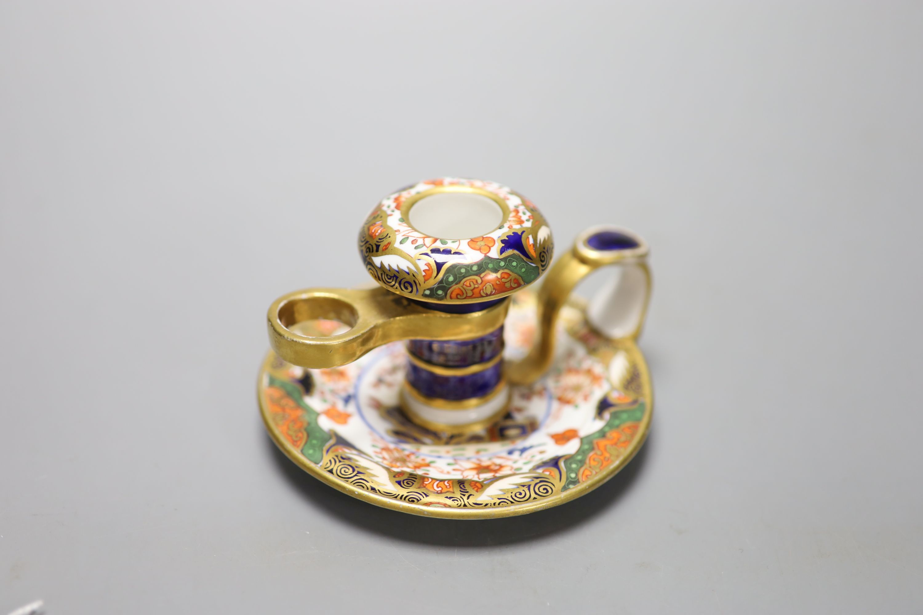 A Spode chamberstick painted with imari pattern 967, Spode mark in red c.1815, height 7cm